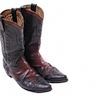 Similar to Western boots, but with an even higher shaft that can reach up to the knee. They have a pointed toe and a high, stacked heel. Buckaroo boots are often decorated with elaborate stitching and embroidery. They are commonly made from leather or exotic skins like python or lizard.