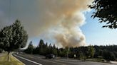 Fire crews responding to brush fire burning near Government Way in Spokane