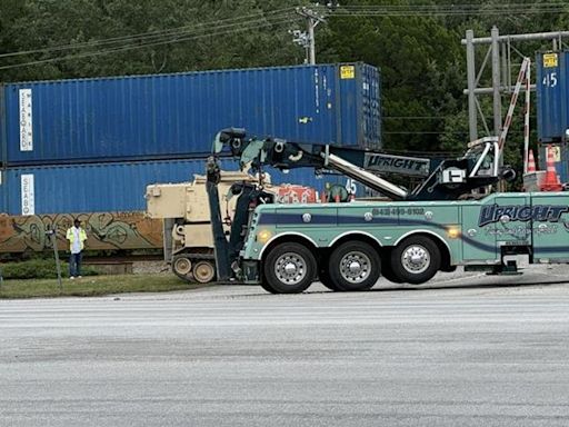 Train hits tractor-trailer carrying a military vehicle in South Carolina