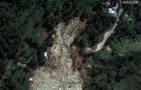 Papua New Guinea says Friday's landslide buried more than 2,000 people and formally asks for help