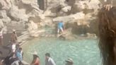 Tourist illegally climbs Rome’s Trevi Fountain to fill her water bottle: ‘What is this lady thinking?!’