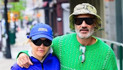 Rita Ora, 33, and husband Taika Waititi, 48, put on a very loved-up display in colourful gym wear as they go for a stroll in New York City