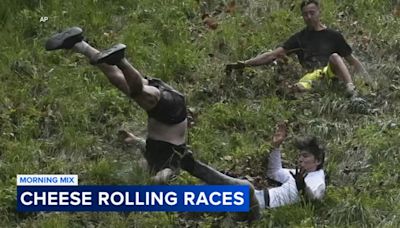 Dozens roll down Cooper's Hill in annual cheese-chasing race in England