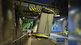 Road closed after lorry gets stuck under bridge