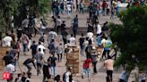 As Bangladesh reels under deadly clashes, 245 Indians return home - The Economic Times