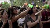 ‘Barcelona is not for sale’: Mass tourism protestors squirt water guns at foreigners as living costs spiral