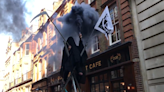 Eight arrests as fake crude oil thrown and 'grim reaper' appears at Extinction Rebellion occupation