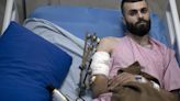 A Palestinian was shot, beaten and tied to an Israeli army jeep. The army says he posed no threat