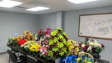 Stolen graveside floral arrangements returned, woman arrested in DeKalb County