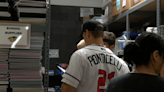 Albuquerque Isotopes players help pack backpacks for students