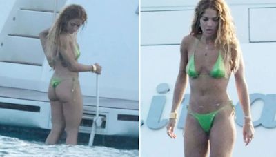 Rita Ora looks stunning as she strips off to green thong bikini for yacht day