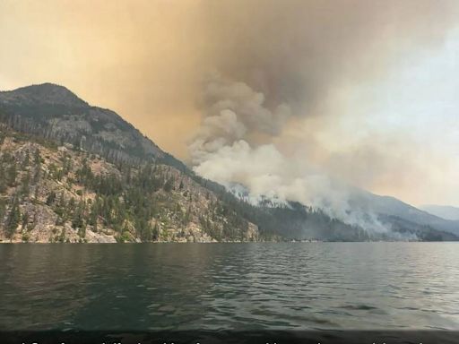 Stehekin, pressed by wildfire, is under evacuation but many may stay