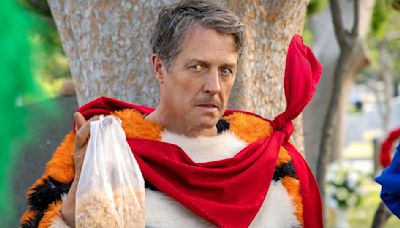 Unfrosted Marks The Third Time Hugh Grant's Played An Orange Character Recently, And He Had A Funny Answer When I...