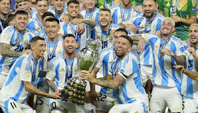 Martinez steps in with winner after injured Messi limps out: Champions Argentina raise the bar with hat-trick of titles