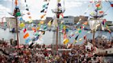 Revelers in festive dress fill downtown Tampa, Florida, for the annual Gasparilla Pirate Fest