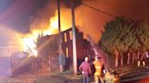Fire engulfs vacant neighborhood factory building in LaPorte, lights up night sky