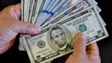 Dollar slips ahead of data, set for first monthly drop in 2024