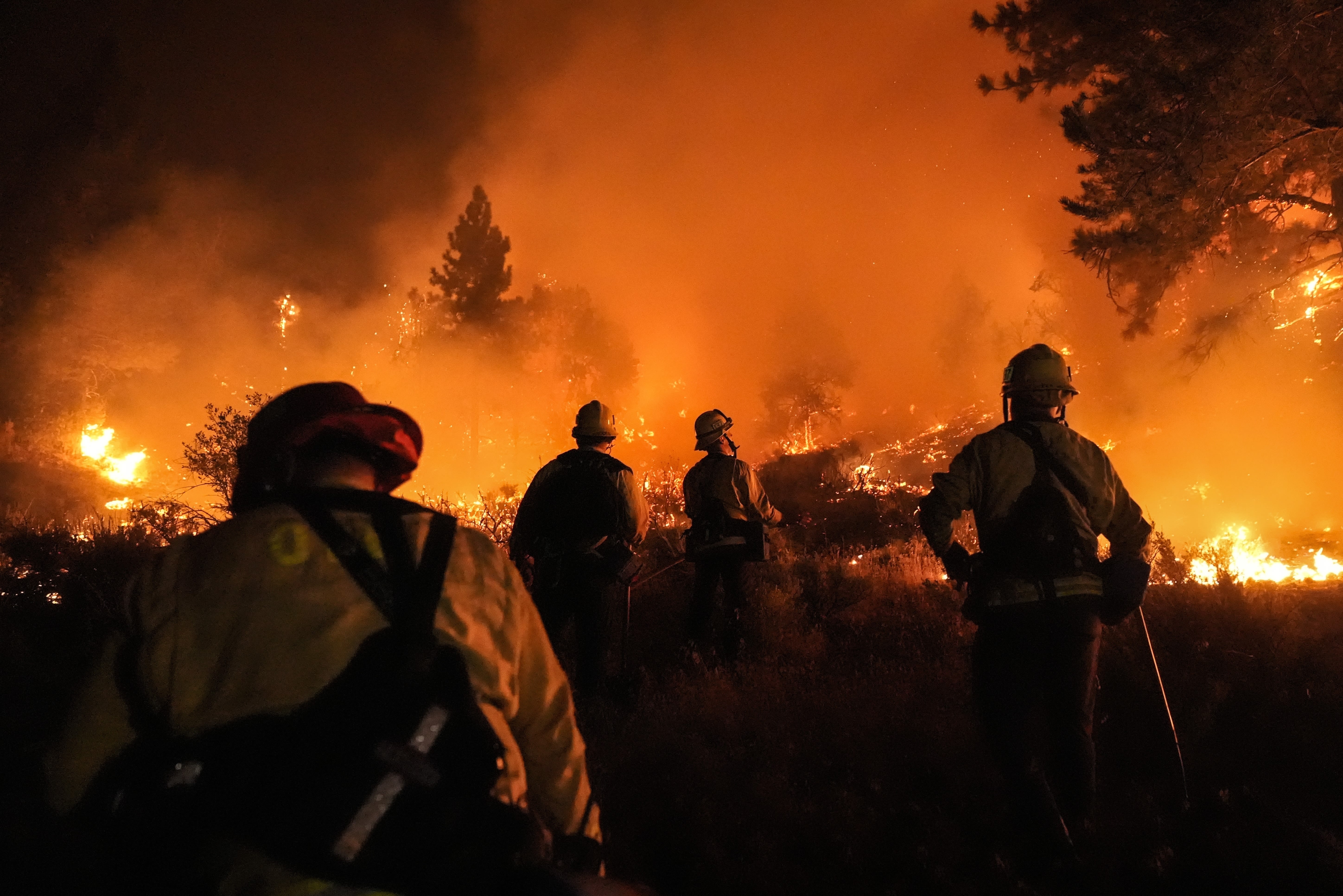 California, Nevada and Oregon wildfires force thousands to evacuate and burn hundreds of thousands of acres