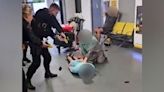 Police officer suspended after airport kicking video