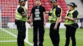 Protestor chains himself to a goalpost ahead of Scotland-Israel women's match