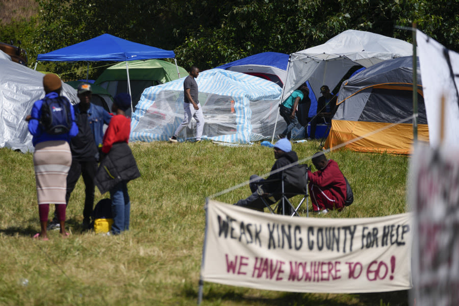 Hundreds of asylum-seekers are camped out near Seattle. There’s a vacant motel next door