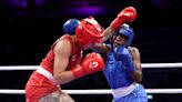 Boxer Ngamba secures first medal for refugee team with quarterfinal win