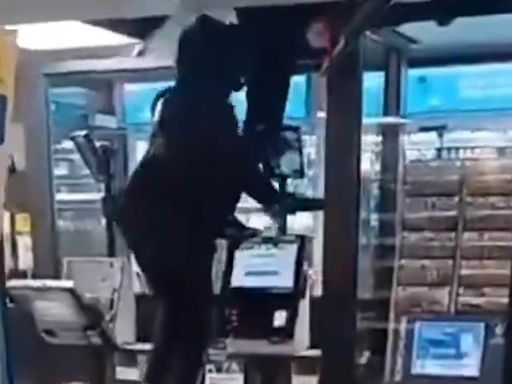 Moment thieves escape Tesco store after smashing a ceiling