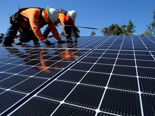 Eamon Ryan hails ‘rooftop revolution’ as 100,000 solar microgenerators connected