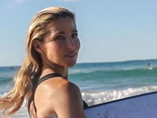 Elsa Pataky she strips down to a swimsuit in the surf