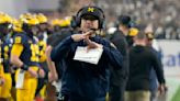 Jim Harbaugh calls Michigan president to say he's staying