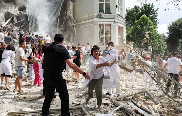 Ukrainian children’s hospital attacked as Russian strikes on cities kill at least 37