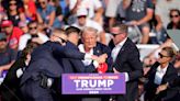 The Latest: Trump whisked from stage following apparent assassination attempt
