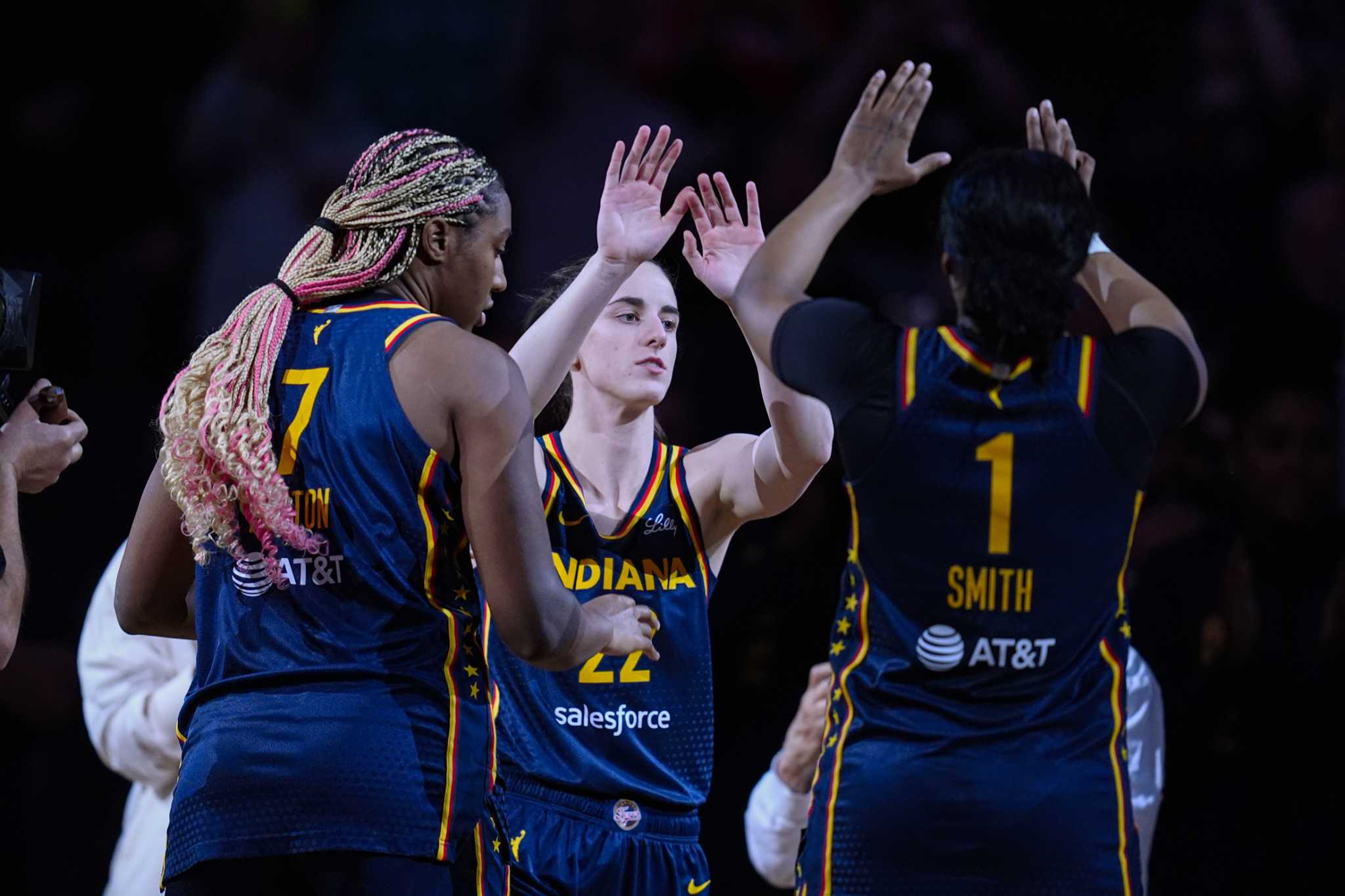 Raucous crowd roars its approval for Caitlin Clark in her home debut with Fever, an 83-80 win