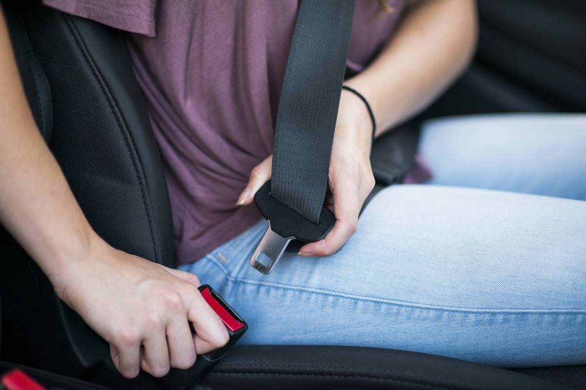 Can I wear my seat belt tucked under my arm in California? Here are the rules