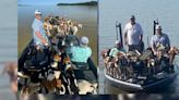 Fishing crew rescues 38 dogs treading water in lake