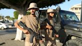 One of Libya’s rival prime ministers warns militias against further clashes after 45 die