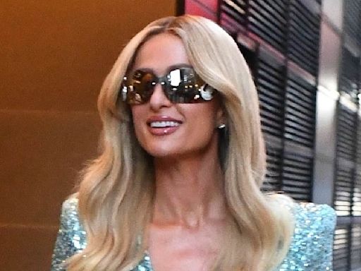 Paris Hilton puts on a glamorous display in blue sequin minidress