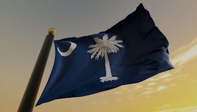 Why are flags flying at half-staff in South Carolina?