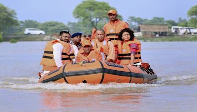 CM Yogi visits flood-hit areas of Pilibhit, Lakhimpur on lifeboat, meets victims | VIDEO