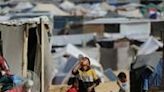 Displaced Palestinians gather their belongings before leaving Al-Mawasi to a safer area in Rafah in the southern Gaza Strip