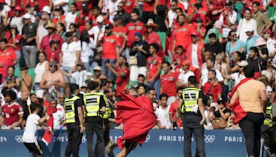 Olympic soccer gets off to violent and chaotic start as Morocco fans rush the field vs Argentina