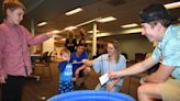 Adrian College teacher education students 'bring the beach' to Adrian District Library