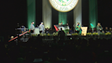 USF student holds up Palestinian flag on graduation stage