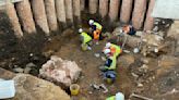 Roman shrine uncovered beneath graveyard in central England