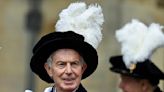 Tony Blair met with protests at Windsor Castle as Queen awards him royal honour