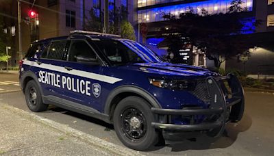 18-year-old woman standing on street shot from car in Seattle’s Northgate area