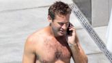 Armie Hammer goes shirtless & reveals bizarre new tattoo in rare public outing