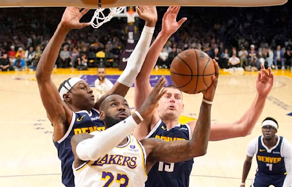 LeBron scores 30, and the Lakers avoid 1st-round elimination with a 119-108 win over champion Denver