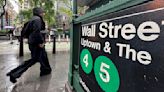 Wall Street hangs near record levels after Dow tops 40,000