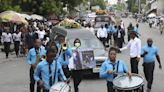 Hundreds mourn gang killings of a Haitian mission director and a young American couple - WTOP News